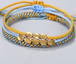 Buddhistisches Kupferperlenarmband – Himmelblau und Gelb